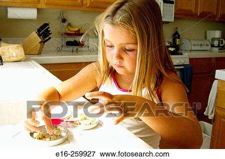 girl cooking View Large Photo Image Stock Photo - girl cooking. Fotosearch