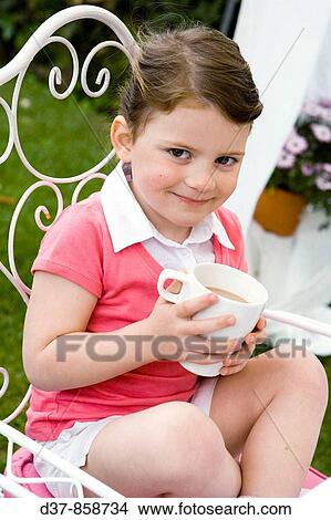 Girl drinking chocolate View Large Photo Image Picture - Girl drinking chocolate. Fotosearch