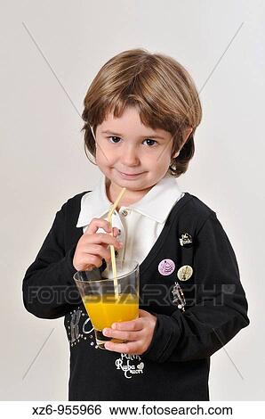 Girl drinking juice fruit View Large Photo Image Stock Photograph - Girl drinking juice fruit. Fotosearch