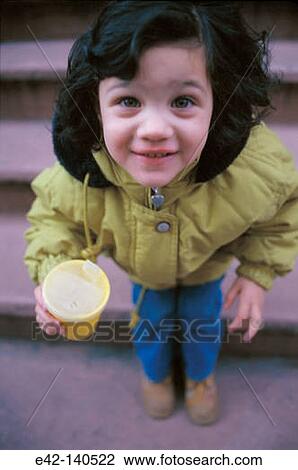 Stock Image - Girl drinking. Fotosearch