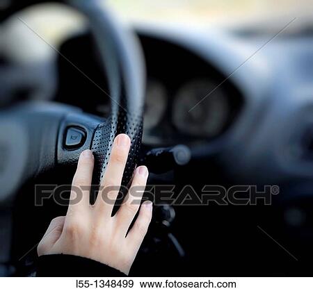 Girl driving a car View Large Photo Image Stock Photo - Girl driving a car. Fotosearch