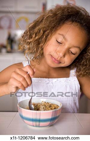 Girl eating. View Large Photo Image Picture - Girl eating.. Fotosearch