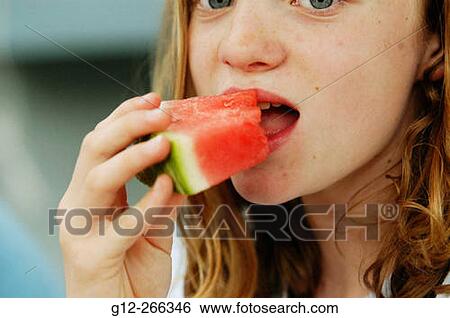 Girl eating watermellon View Large Photo Image Stock Photograph - Girl eating watermellon. Fotosearch