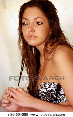 Girl fixing hair View Large Photo Image Stock Photography - Girl fixing hair. Fotosearch