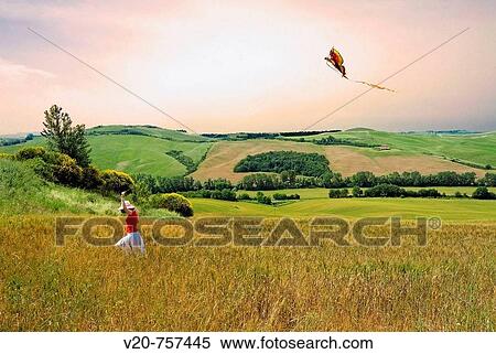 Girl flies a kite in a wheat field near Asciano, Siena province, Crete senesi, Tuscany, Italy View Large Photo Image Stock Photography - Girl flies a kite in a wheat field near Asciano, Siena province, Crete senesi, Tuscany, Italy. Fotosearch
