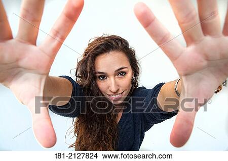 Picture - girl framing her face. Fotosearch