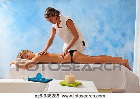 Girl getting back massage View Large Photo Image Stock Photography - Girl getting back massage. Fotosearch