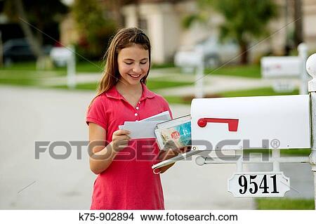 Picture - girl getting the mail. Fotosearch