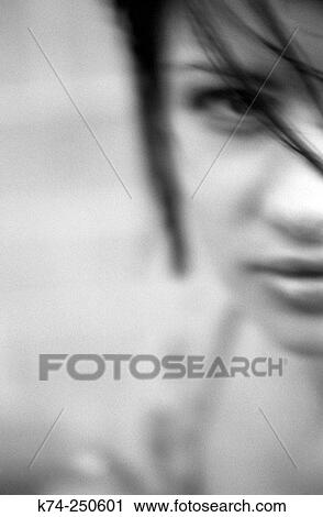 Stock Image - Girl Glancing At Camera. Fotosearch