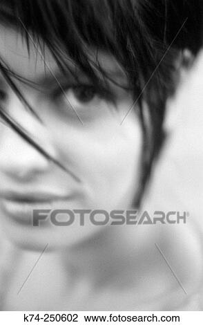 Stock Image - Girl Glancing At Camera. Fotosearch
