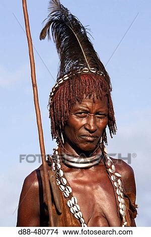 Girl Hamer tribe. Lower basin of Omo river. Gathering before the fest of the whipping ceremony and the bull jumping. Copper skin with very fine features and wear metal arm and leg bracelets, shells and beads. South Ethiopia. View Large Photo Image Picture - Girl Hamer tribe. Lower basin of Omo river. Gathering before the fest of the whipping ceremony and the bull jumping. Copper skin with very fine features and wear metal arm and leg bracelets, shells and beads. South Ethiopia.. Fotosearch