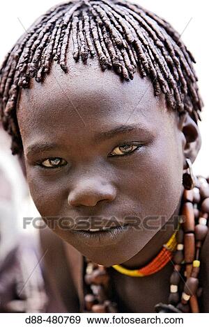 Girl Hamer tribe. Lower basin of Omo river. Gathering before the fest of the whipping ceremony and the bull jumping. Copper skin with very fine features and wear metal arm and leg bracelets, shells and beads. South Ethiopia. View Large Photo Image Stock Photo - Girl Hamer tribe. Lower basin of Omo river. Gathering before the fest of the whipping ceremony and the bull jumping. Copper skin with very fine features and wear metal arm and leg bracelets, shells and beads. South Ethiopia.. Fotosearch