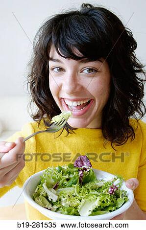 Girl having a salad View Large Photo Image Stock Photography - Girl having a salad. Fotosearch