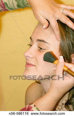 Stock Photograph - Girl having make-up.. Fotosearch