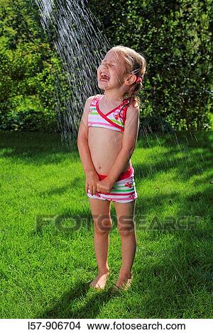 girl having shower outdoors, Switzerland View Large Photo Image Picture - girl having shower outdoors, Switzerland. Fotosearch