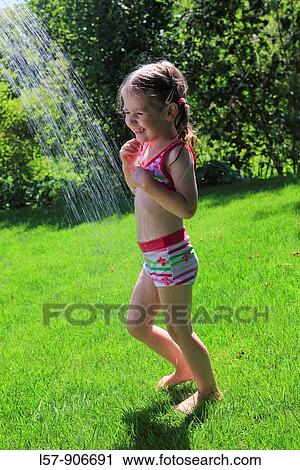 girl having shower outdoors, Switzerland View Large Photo Image Stock Image - girl having shower outdoors, Switzerland. Fotosearch