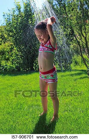 girl having shower outdoors, Switzerland View Large Photo Image Stock Image - girl having shower outdoors, Switzerland. Fotosearch