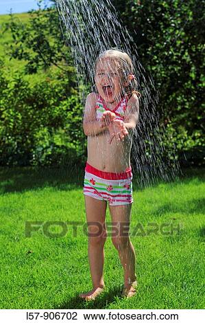 girl having shower outdoors, Switzerland View Large Photo Image Stock Image - girl having shower outdoors, Switzerland. Fotosearch