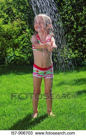 girl having shower outdoors, Switzerland View Large Photo Image Stock Image - girl having shower outdoors, Switzerland. Fotosearch