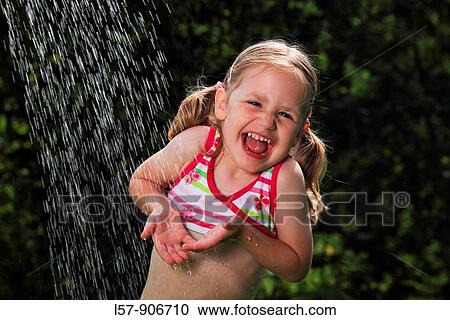 girl having shower outdoors, Switzerland View Large Photo Image Stock Image - girl having shower outdoors, Switzerland. Fotosearch