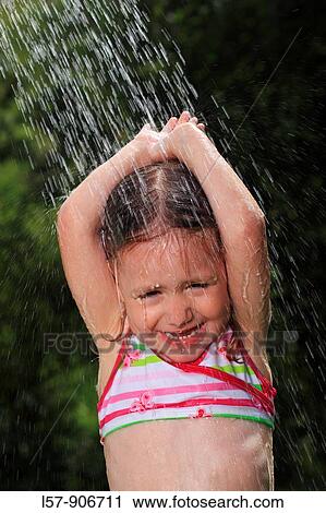girl having shower outdoors, Switzerland View Large Photo Image Stock Image - girl having shower outdoors, Switzerland. Fotosearch