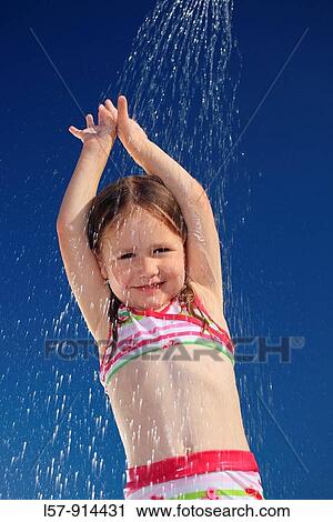 girl having shower outdoors, Switzerland View Large Photo Image Stock Image - girl having shower outdoors, Switzerland. Fotosearch