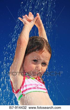 girl having shower outdoors, Switzerland View Large Photo Image Stock Image - girl having shower outdoors, Switzerland. Fotosearch