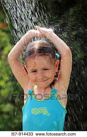 girl having shower outdoors, Switzerland View Large Photo Image Stock Image - girl having shower outdoors, Switzerland. Fotosearch