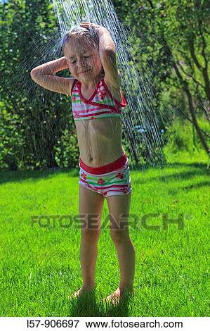 girl having shower outdoors, Switzerland View Large Photo Image Stock Photo - girl having shower outdoors, Switzerland. Fotosearch
