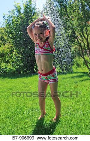 girl having shower outdoors, Switzerland View Large Photo Image Stock Photo - girl having shower outdoors, Switzerland. Fotosearch