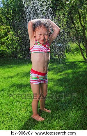 girl having shower outdoors, Switzerland View Large Photo Image Stock Photo - girl having shower outdoors, Switzerland. Fotosearch