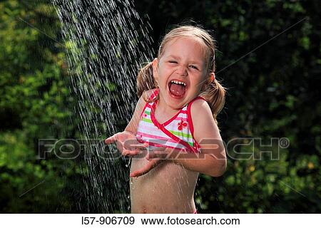 girl having shower outdoors, Switzerland View Large Photo Image Stock Photo - girl having shower outdoors, Switzerland. Fotosearch