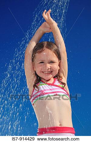 girl having shower outdoors, Switzerland View Large Photo Image Stock Photo - girl having shower outdoors, Switzerland. Fotosearch