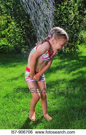 girl having shower outdoors, Switzerland View Large Photo Image Stock Photograph - girl having shower outdoors, Switzerland. Fotosearch