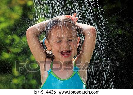girl having shower outdoors, Switzerland View Large Photo Image Stock Photography - girl having shower outdoors, Switzerland. Fotosearch