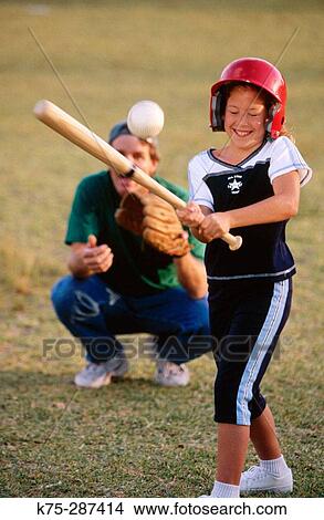 Girl hitting the ball View Large Photo Image Picture - Girl hitting the ball. Fotosearch