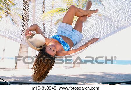Stock Photo - girl in a hammock. Fotosearch