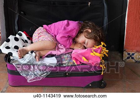 Stock Photo - Girl in a suitcase. Fotosearch