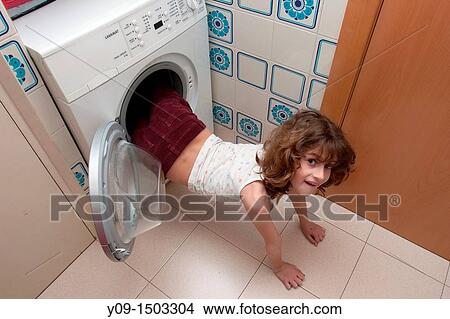 Girl in a washing machine View Large Photo Image Picture - Girl in a washing machine. Fotosearch