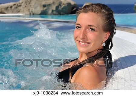 Picture - Girl in a whirlpool under the sun. Fotosearch