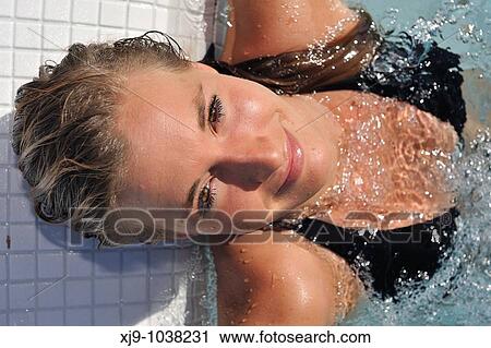Stock Image - Girl in a whirlpool under the sun. Fotosearch
