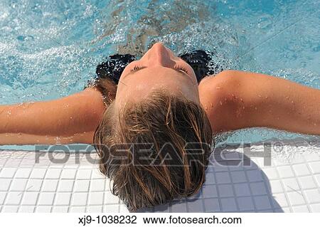 Stock Image - Girl in a whirlpool under the sun. Fotosearch