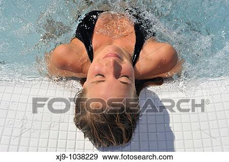 Girl in a whirlpool under the sun View Large Photo Image Stock Photo - Girl in a whirlpool under the sun. Fotosearch
