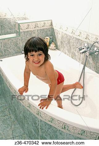 Girl in bathroom washing View Large Photo Image Stock Image - Girl in bathroom washing. Fotosearch