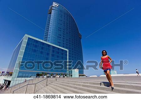 Girl in front of W Hotel Barcelona, Spain View Large Photo Image Picture - Girl in front of W Hotel Barcelona, Spain. Fotosearch