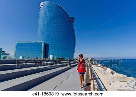 Girl in front of W Hotel Barcelona, Spain View Large Photo Image Stock Photo - Girl in front of W Hotel Barcelona, Spain. Fotosearch