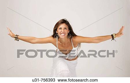 Girl in her early 40s spreading her arms View Large Photo Image Stock Image - Girl in her early 40s spreading her arms. Fotosearch