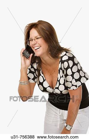 Girl in her early 40s talking on the phone smiling View Large Photo Image Stock Photo - Girl in her early 40s talking on the phone smiling. Fotosearch