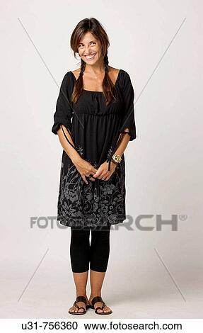 Girl in her early 40s wearing sandals smiling View Large Photo Image Stock Image - Girl in her early 40s wearing sandals smiling. Fotosearch