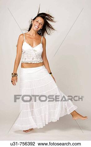 Girl in her early 40s with wind in her hair smiling View Large Photo Image Stock Image - Girl in her early 40s with wind in her hair smiling. Fotosearch